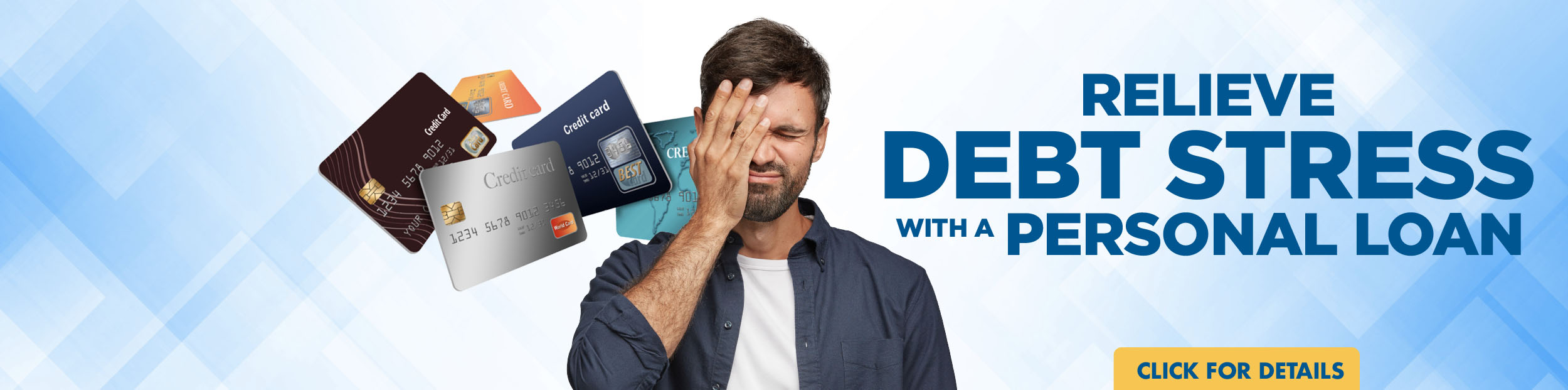 Adult male with his head in his hands surrounded by credit cards.