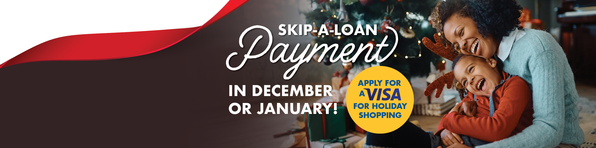 Happy mother and son sitting with each other next to the Christmas tree.