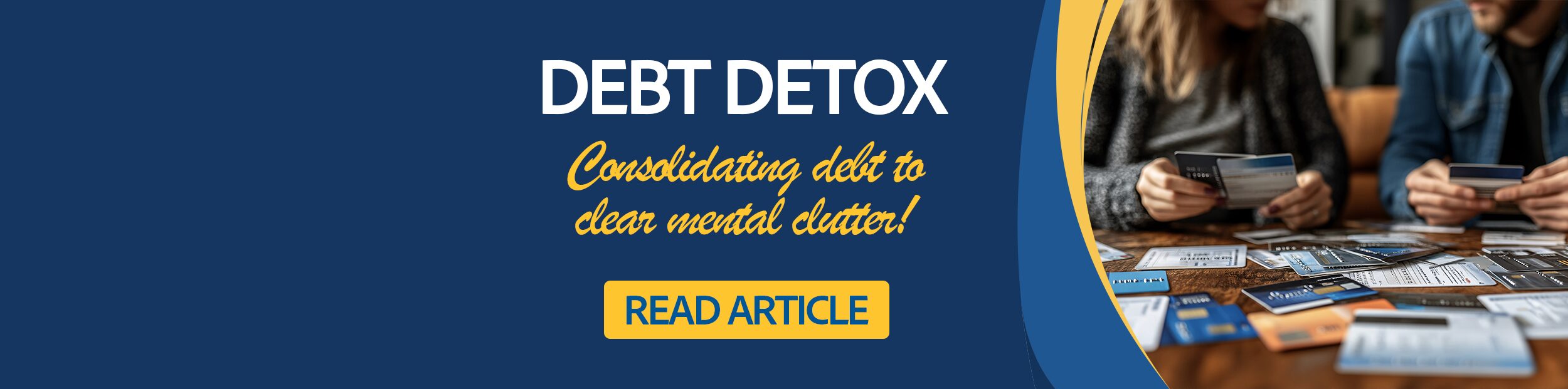 Close up of a couple laying out credit cards and associated bills on a table.